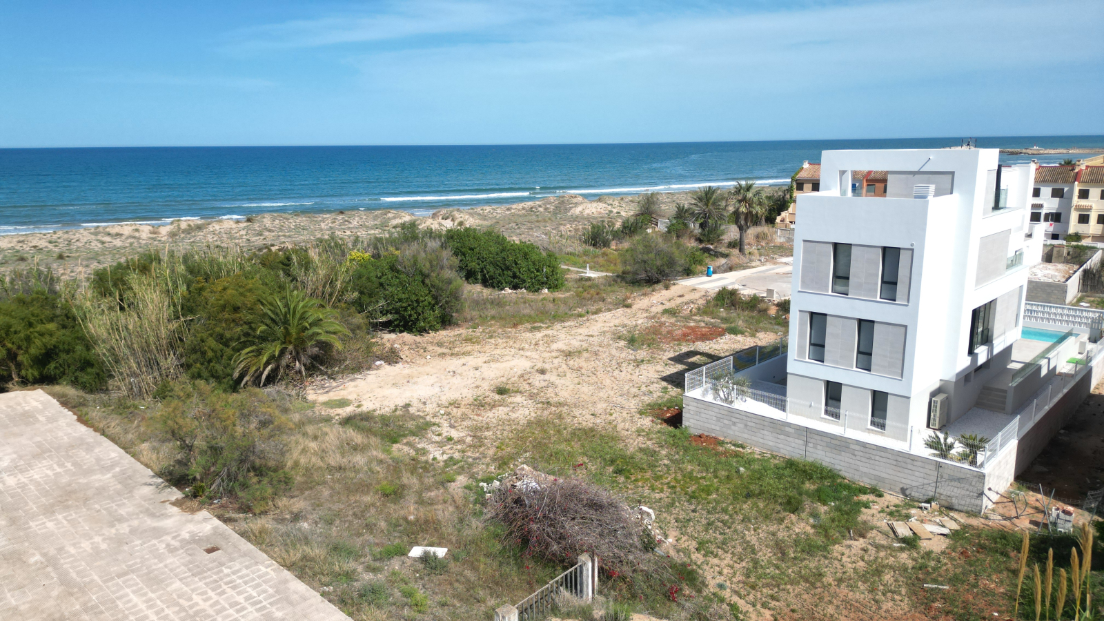 New build luxury villa with direct beach access only a short distance from the harbour and golf course.