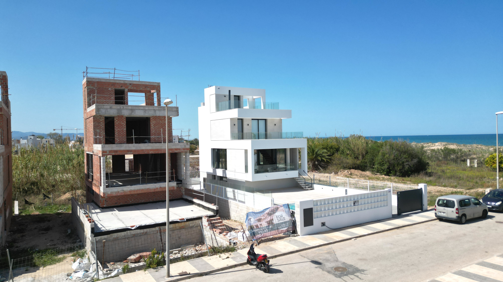 New build luxury villa with direct beach access only a short distance from the harbour and golf course.